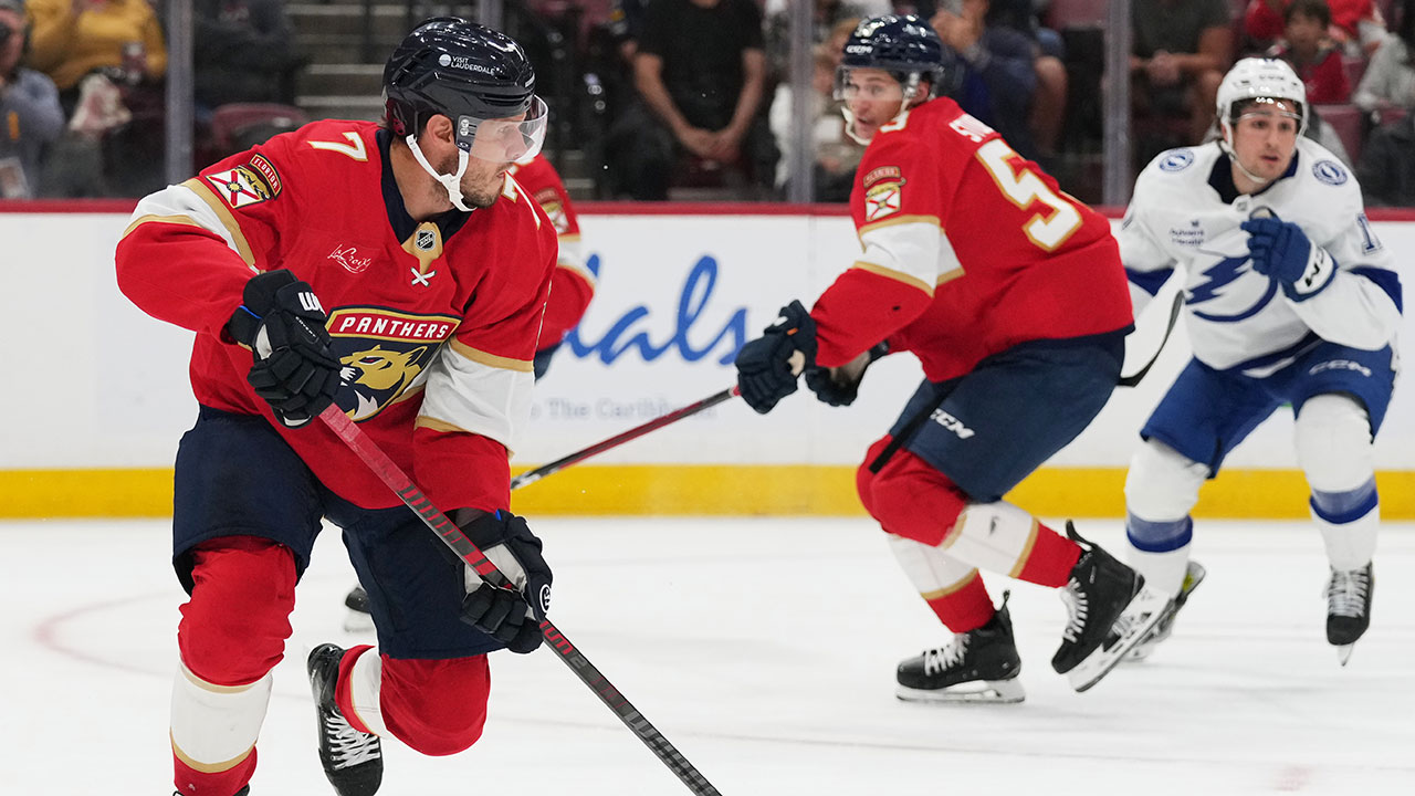 Florida Panthers defenseman Dmitry Kulikov (7) skates with the puck during the first period of an NHL hockey preseason game against the Tampa Bay Lightning, Saturday, Oct. 4, 2025, in Sunrise, Fla.