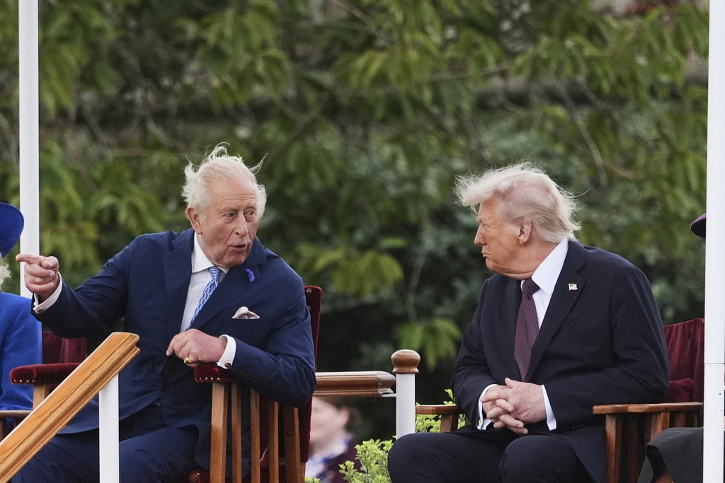 President Donald Trump, right, speaks with Britain's King Charles III as they attend a Beating Retreat musical performance on the East Lawn of Windsor Castle, in Windsor, England, Wednesday, Sept. 17, 2025. 
