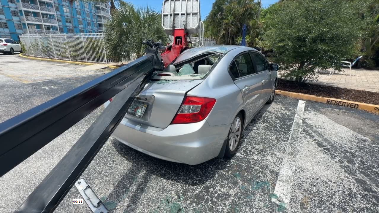 Car crushed in St. Petersburg after cherry picker fell over