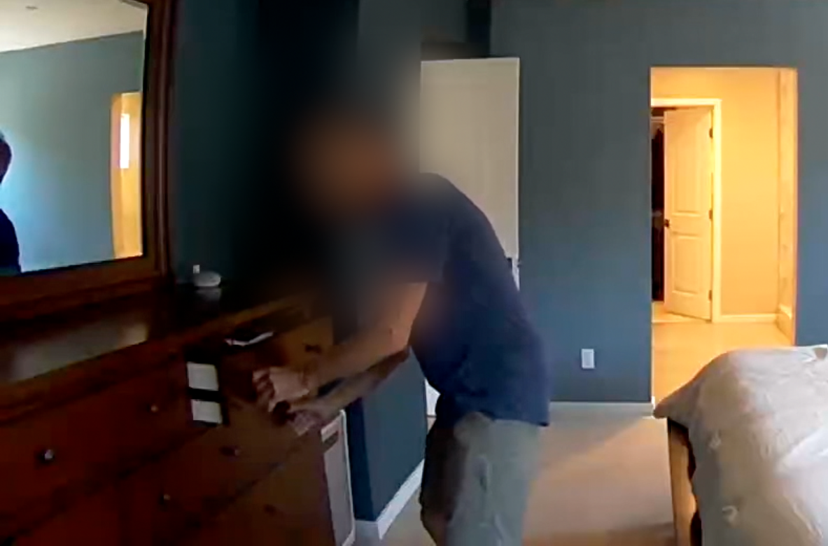 Man caught on video looking through drawers at open house 