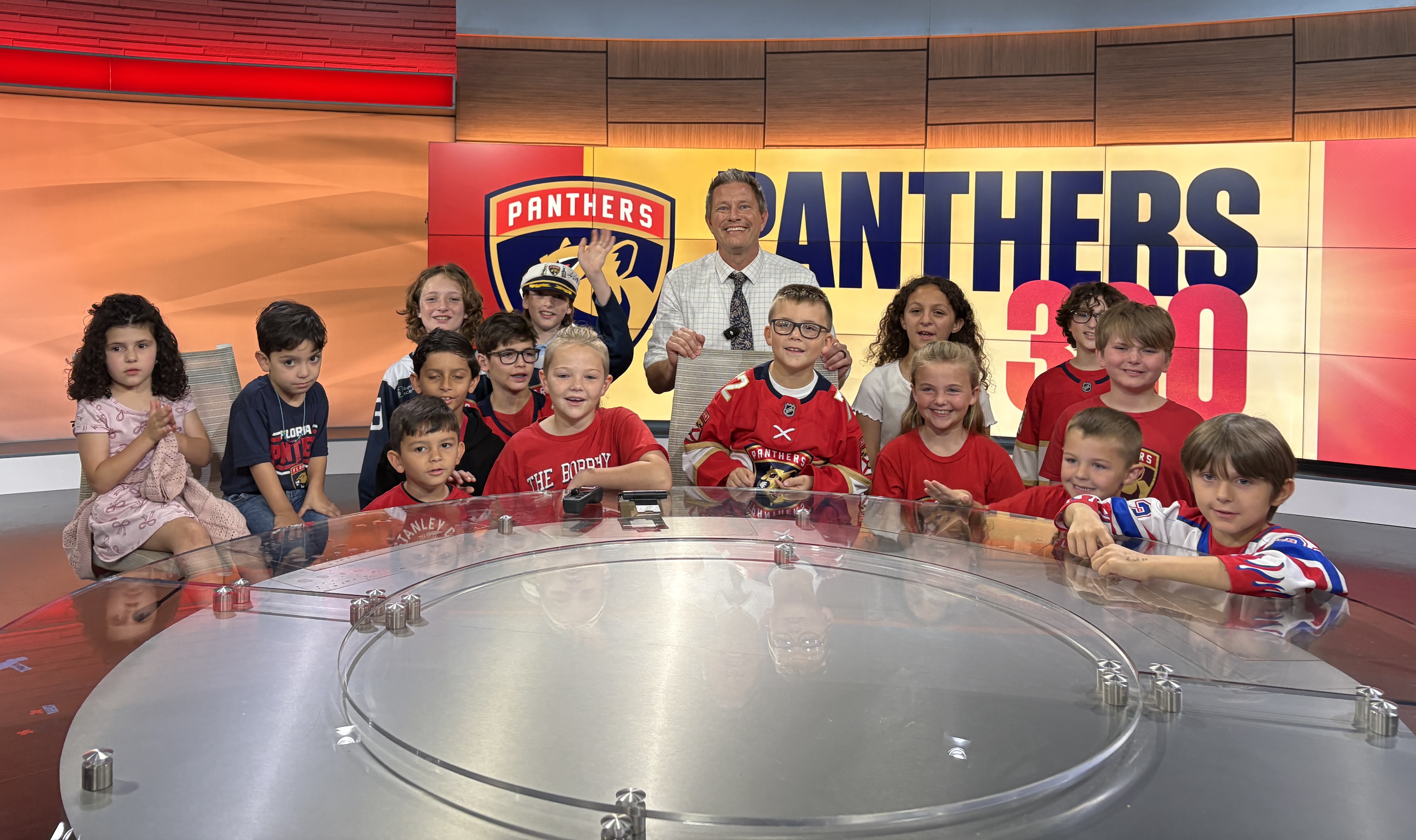 WPTV Anchor and Panthers 360 Host Mike Trim with the Florida Panthers Kids Club