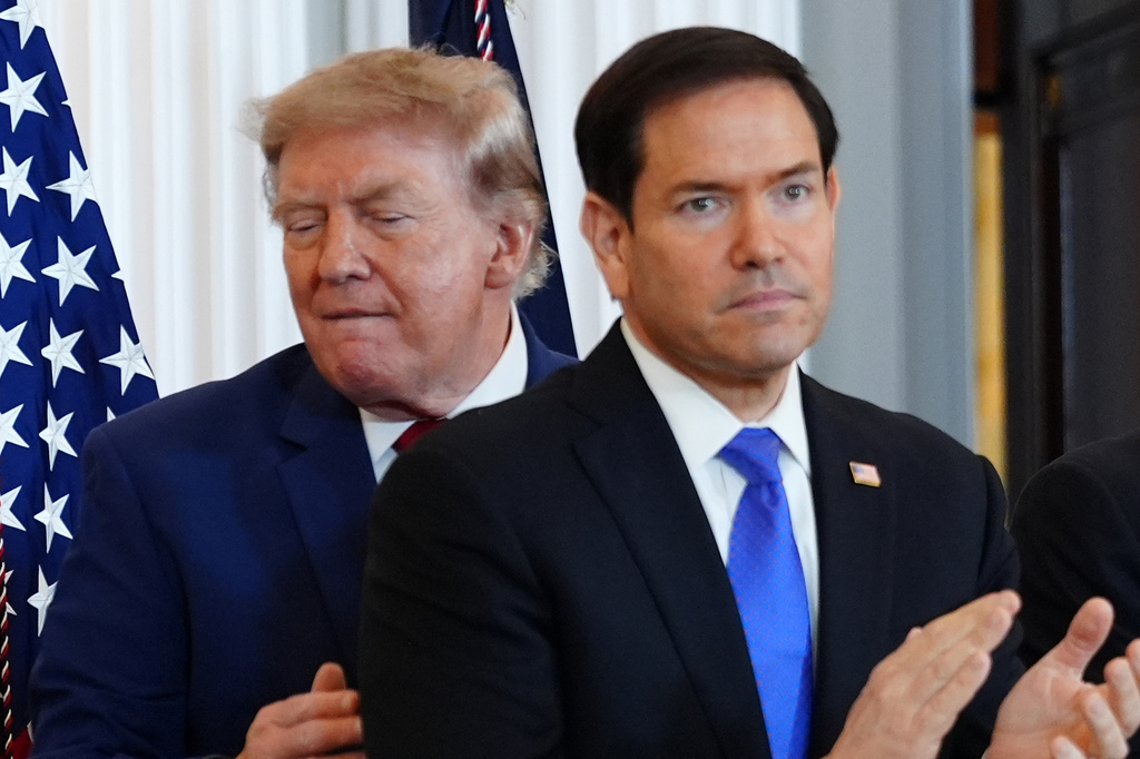 President Donald Trump walks past Secretary of State Marco Rubio as he arrives for a roundtable on the American mining industry, Friday, Aug. 7, 2026, at the State Department in Washington.