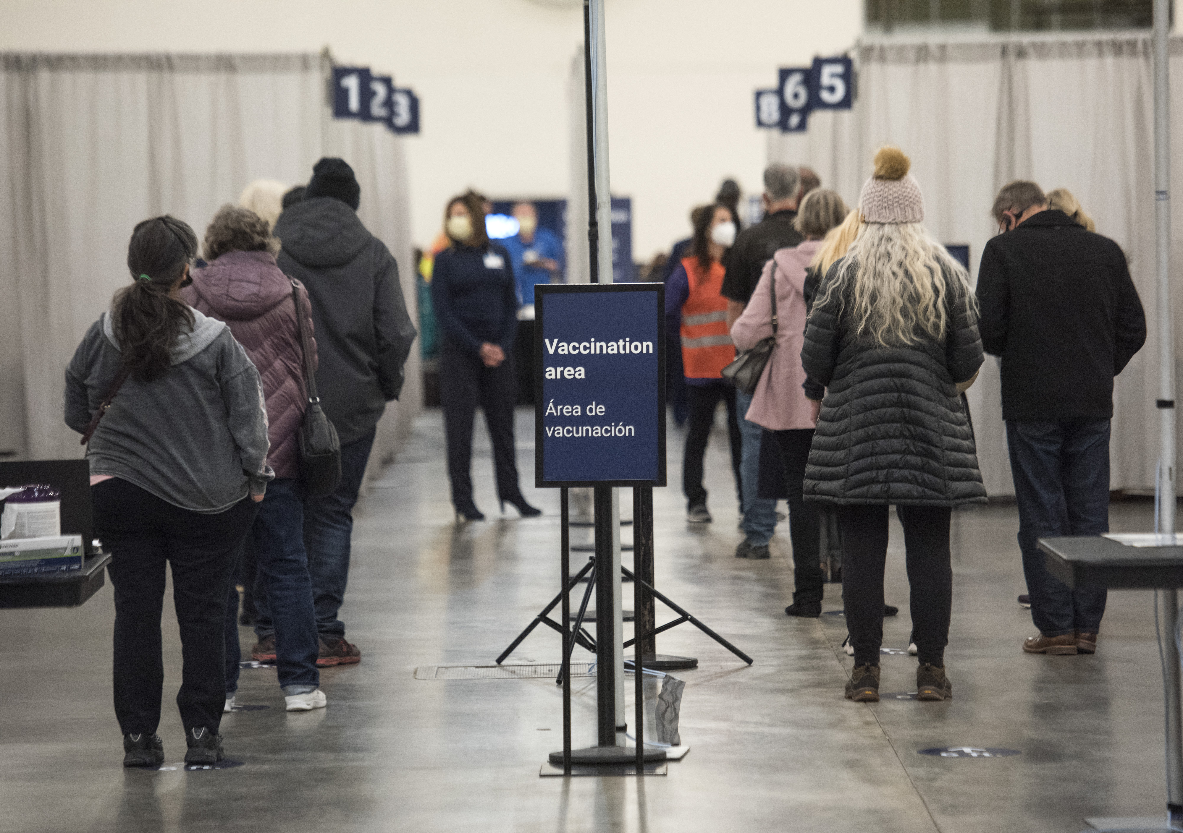 Line of people waiting to be vaccinated