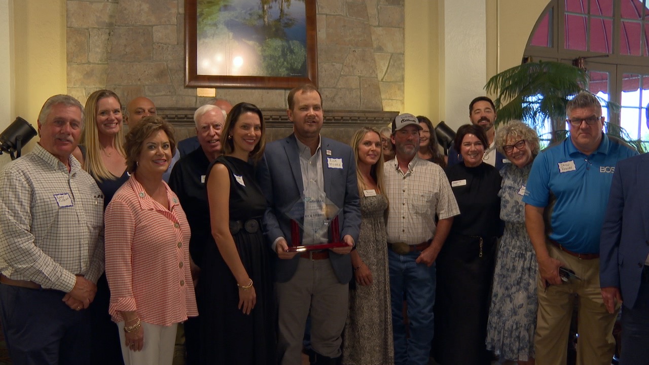 WCS Superintendent Richard Myhre accepts the WCEDC Economic Champion of the Year award