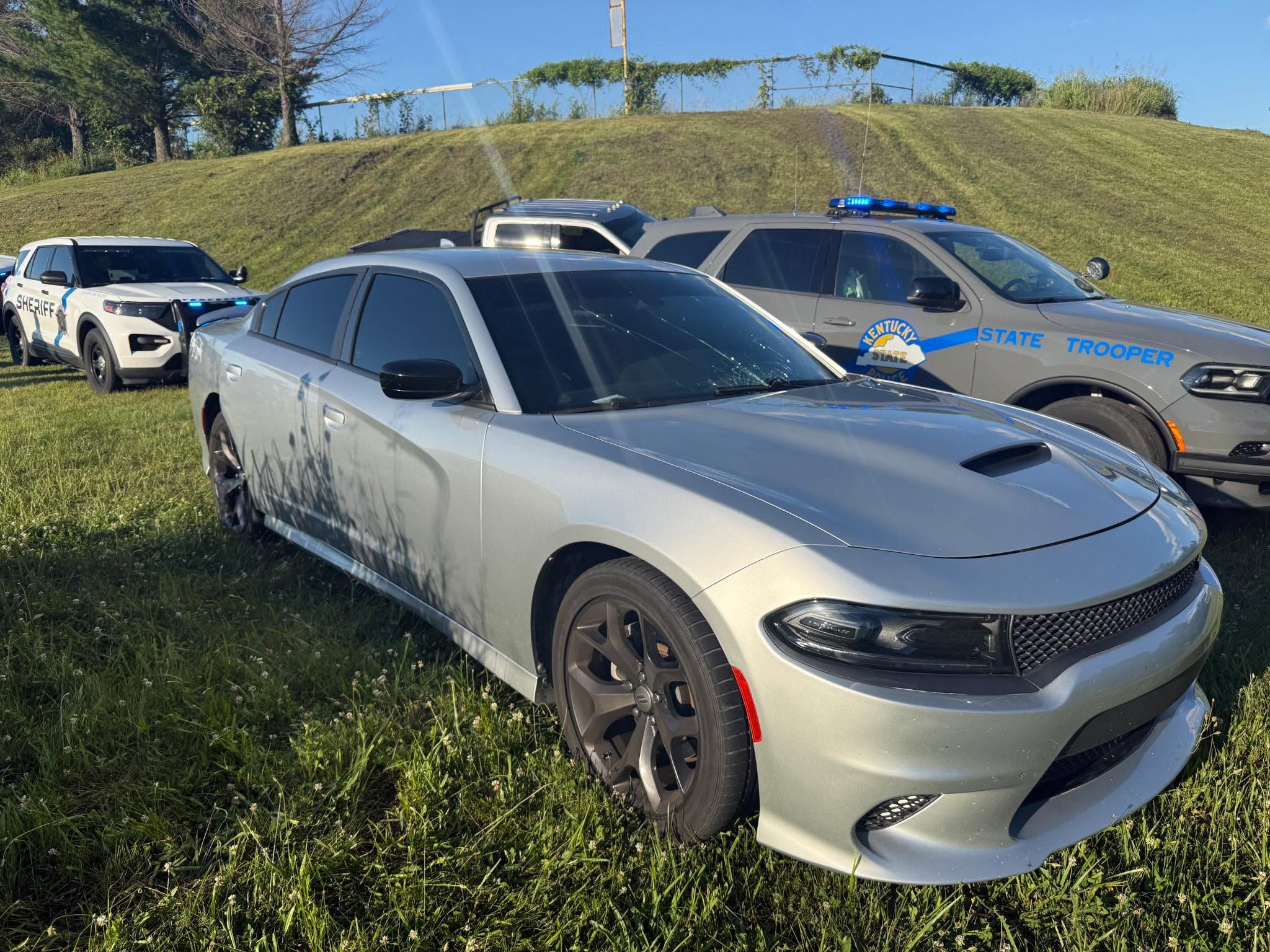 May be an image of car and text that says 'M CHTИCKy PRE STATE TROOPER'.png