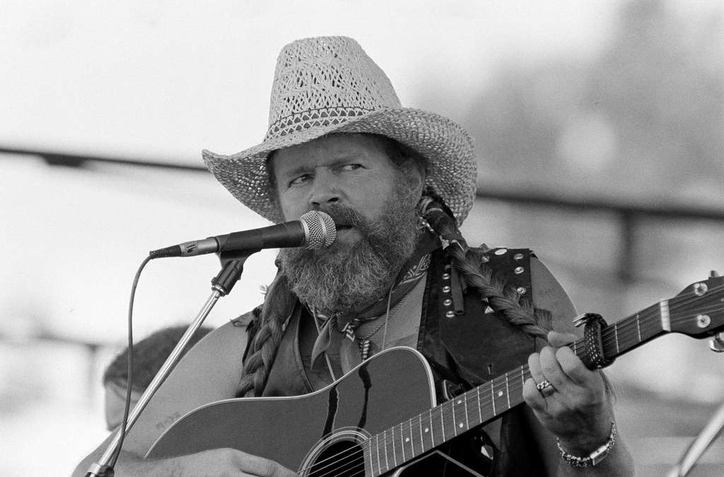  David Allan Coe, sporting Willie Nelson braids, performs at the Willie Nelson July 4th Picnic, on July 4, 1983 at Atlanta International Raceway in Hampton, Ga. 