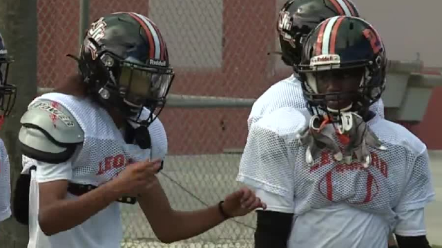 Steven Matos and Tyrell Barr, both deaf football players at John I. Leonard High School, at practice on Sept. 20, 2023.jpg