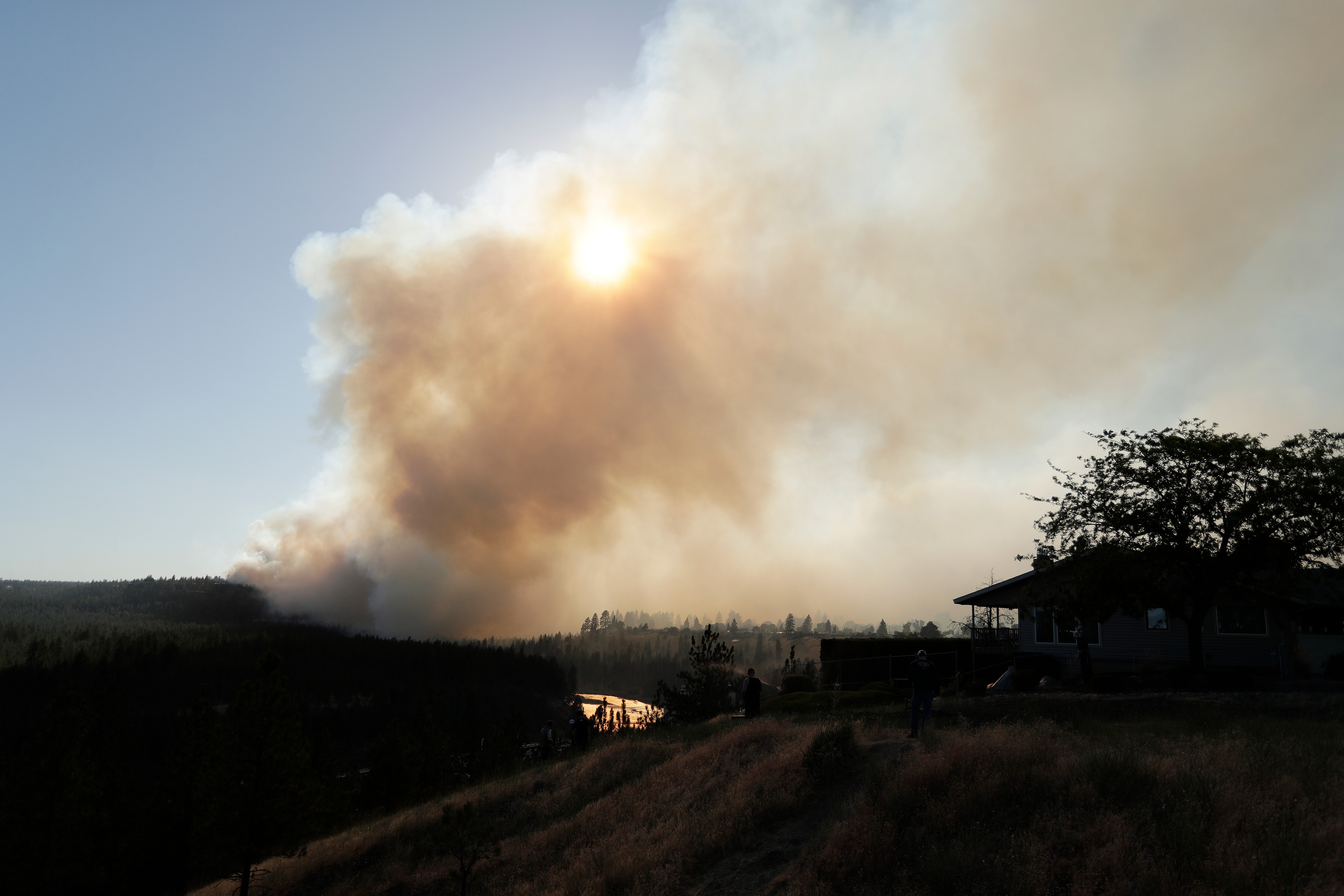 Old Trails Fire is seen from W. Northwest Blvd., Saturday, Aug. 1, 2026, in Spokane, Wash.