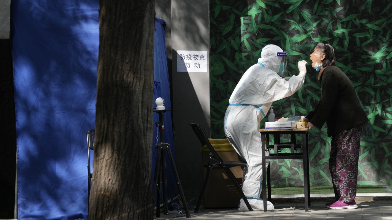 An elderly resident gets swabbed during a COVID-19 test