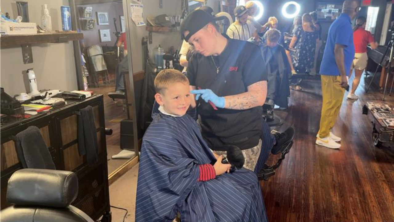Local barbershop sends students off with fresh cut for new school year