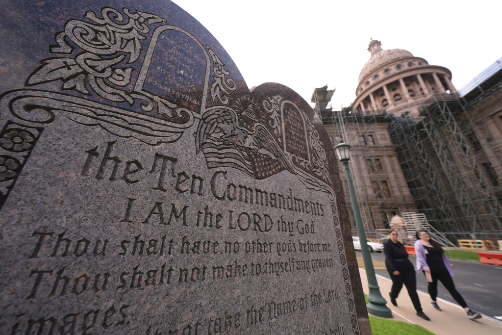 A granite Ten Commandments monument stands on the ground of the Texas Capitol.