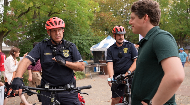 WCPO 9 News reporter Sam Harasimowicz with two CFD bike team members