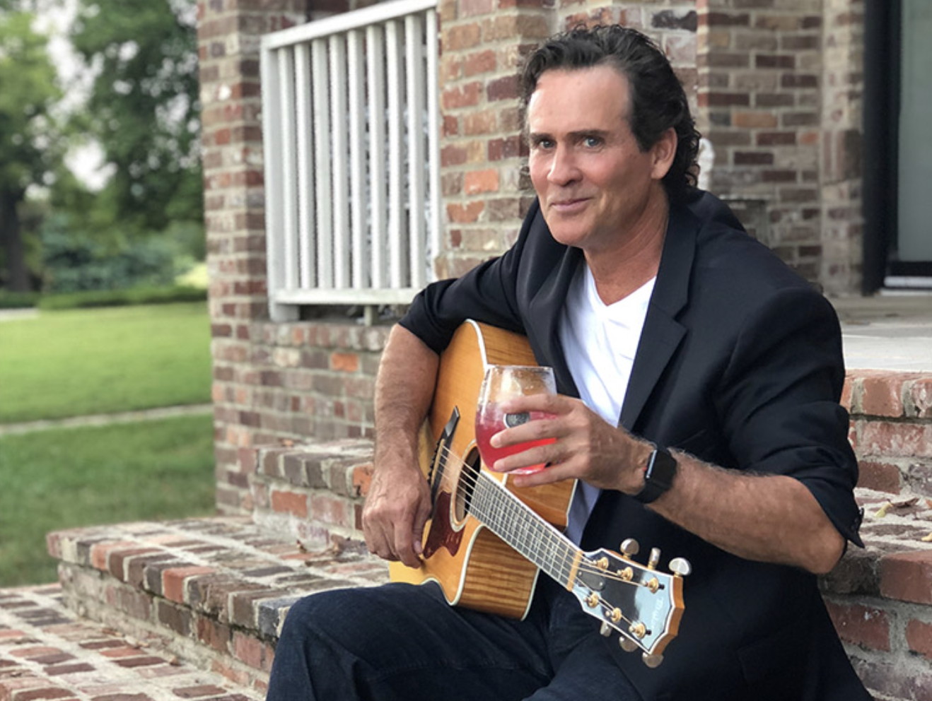 Joe Lara with guitar.png