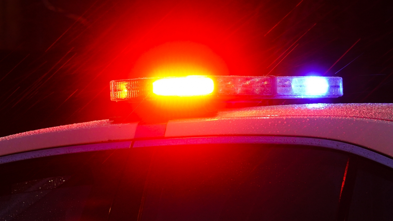Police car with flashing lights.