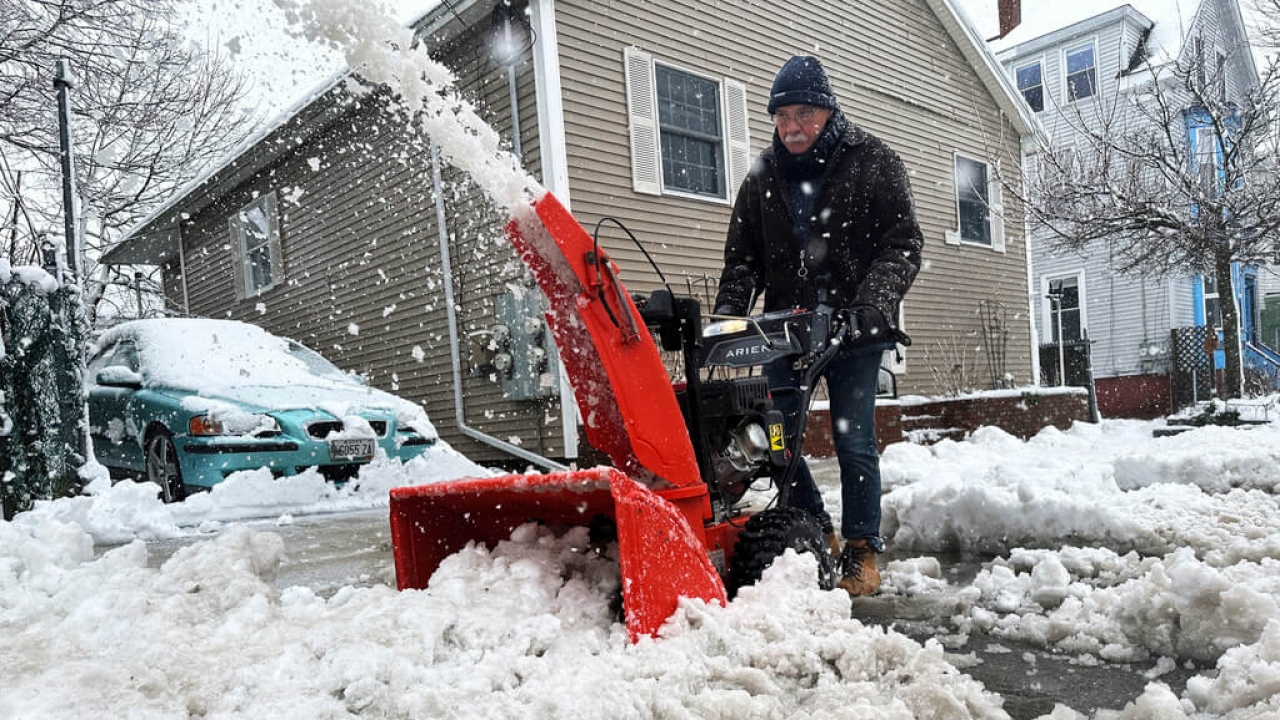 A person uses a snowblower in Portland, Maine