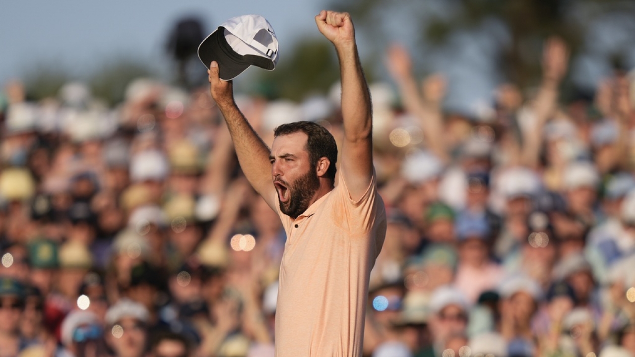 Scottie Scheffler celebrates his win at the Masters.