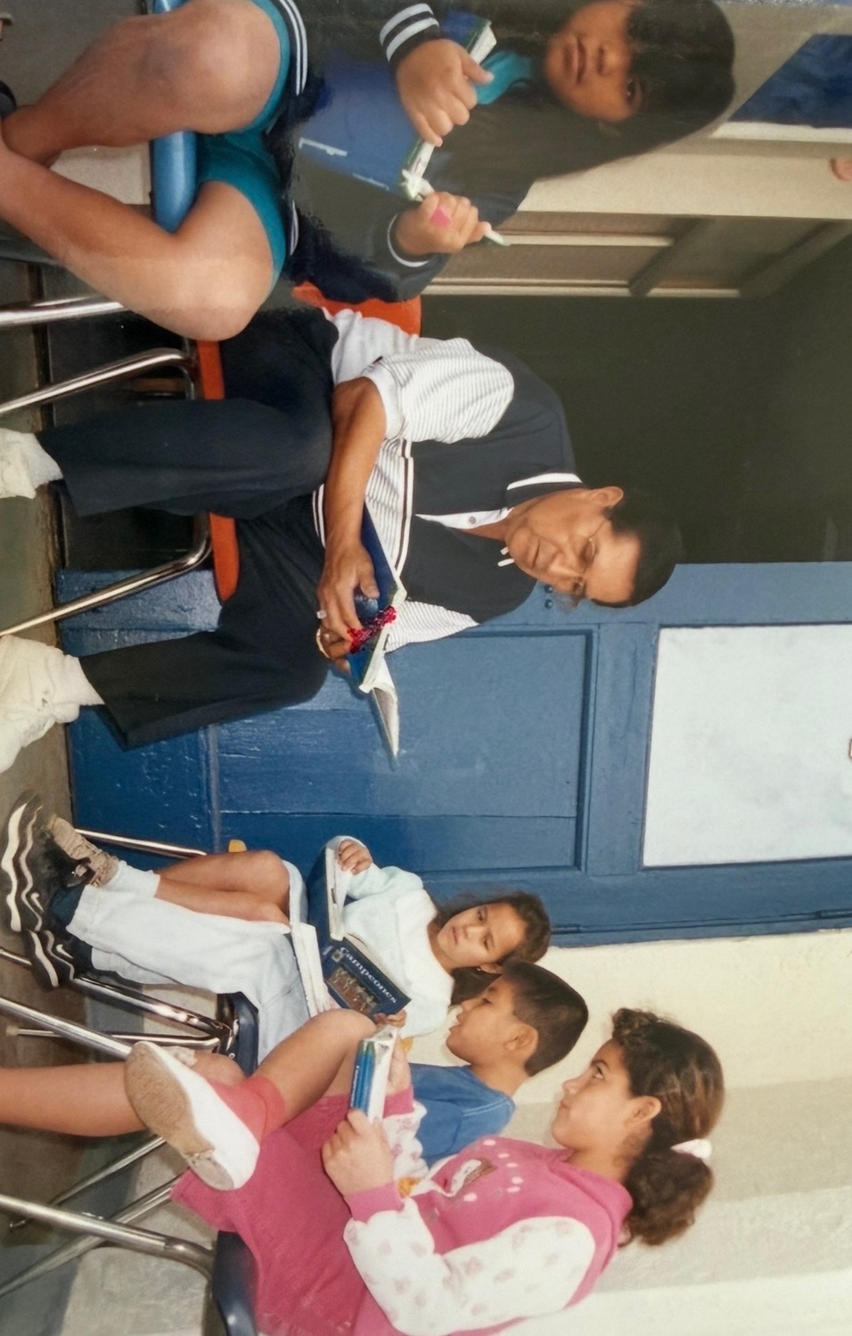 Roy Guerrero tutors kids at the Escondido Union School District. 