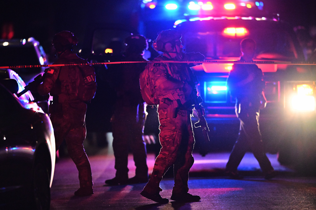 Law enforcement officials respond to an address connected to Cole Tomas Allen, the shooting suspect at the White House Correspondents Dinner on Saturday, April 25, 2026, in Torrance, Calif.