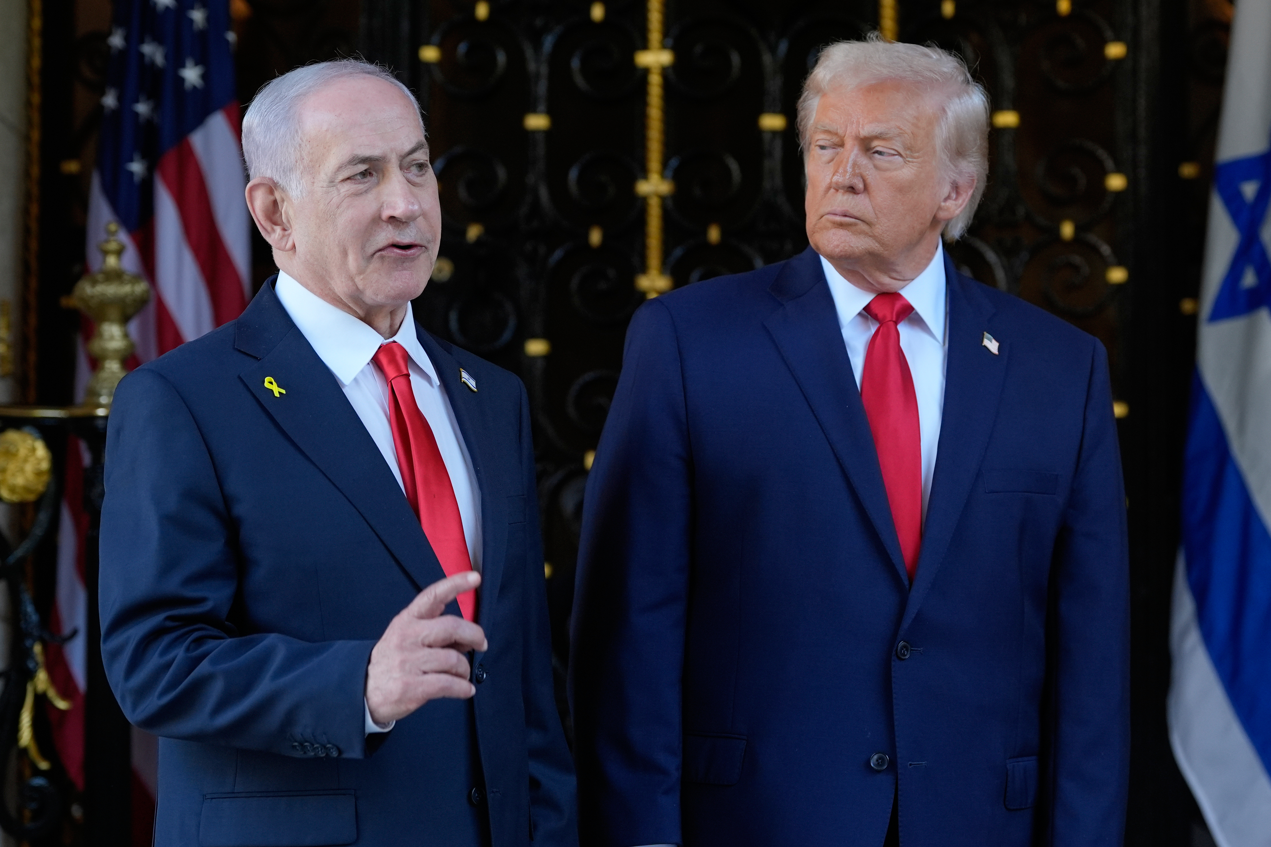 FILE - President Donald Trump listens as Israel's Prime Minister Benjamin Netanyahu speaks at President Donald Trump's Mar-a-Lago club, Dec. 29, 2025, in Palm Beach, Fla.
