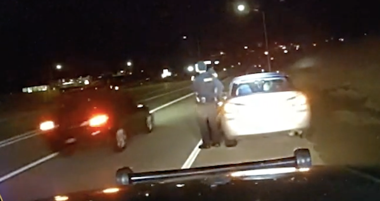 Police dash cam shows a driver not moving over when the officer is conducting a separate traffic stop. 