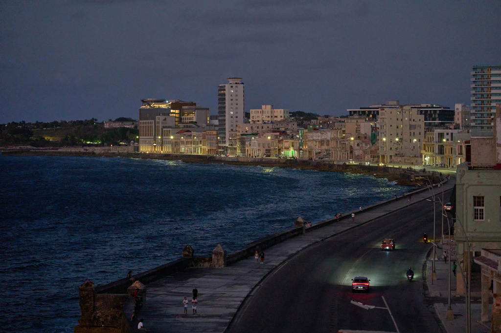 Vehicles traverse the Malecon at dusk in Havana, Wednesday, April 15, 2026.