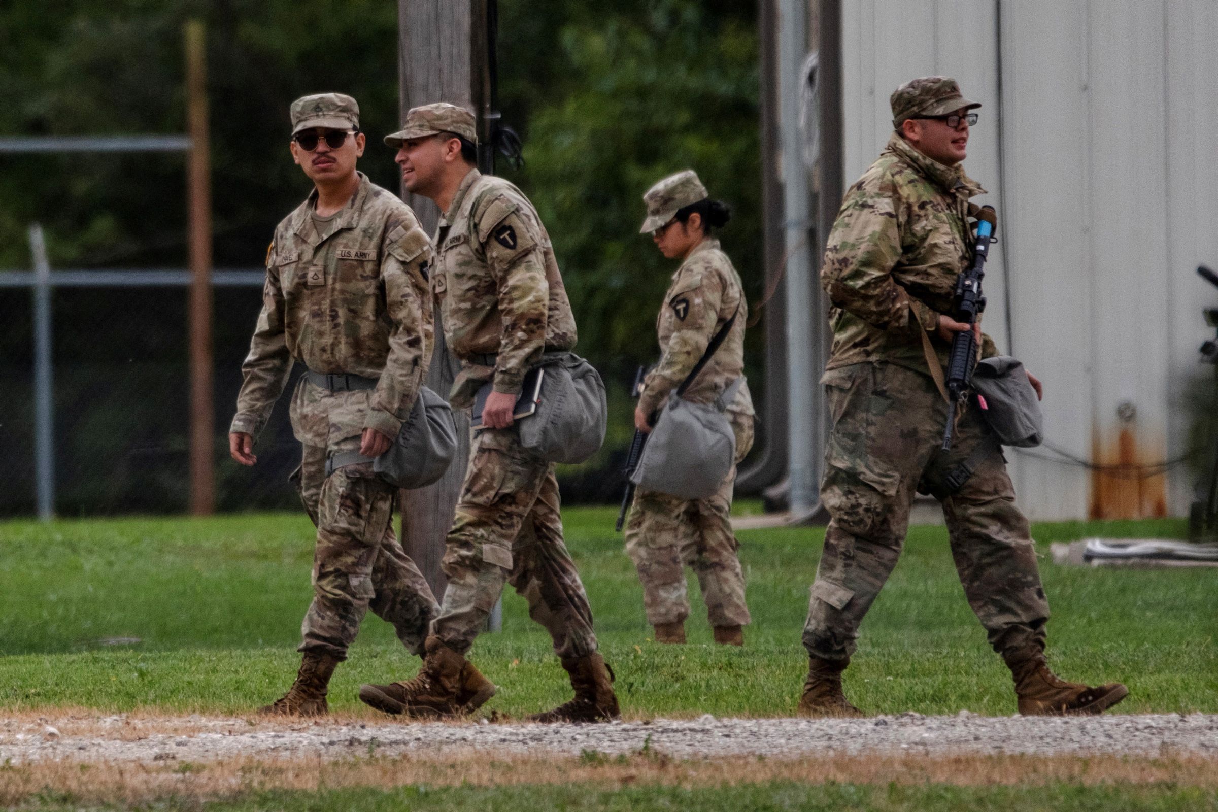 Texas National Guard troops walk through the Joliet Army Reserve Training Center in Elwood, Illinois, on October 7.