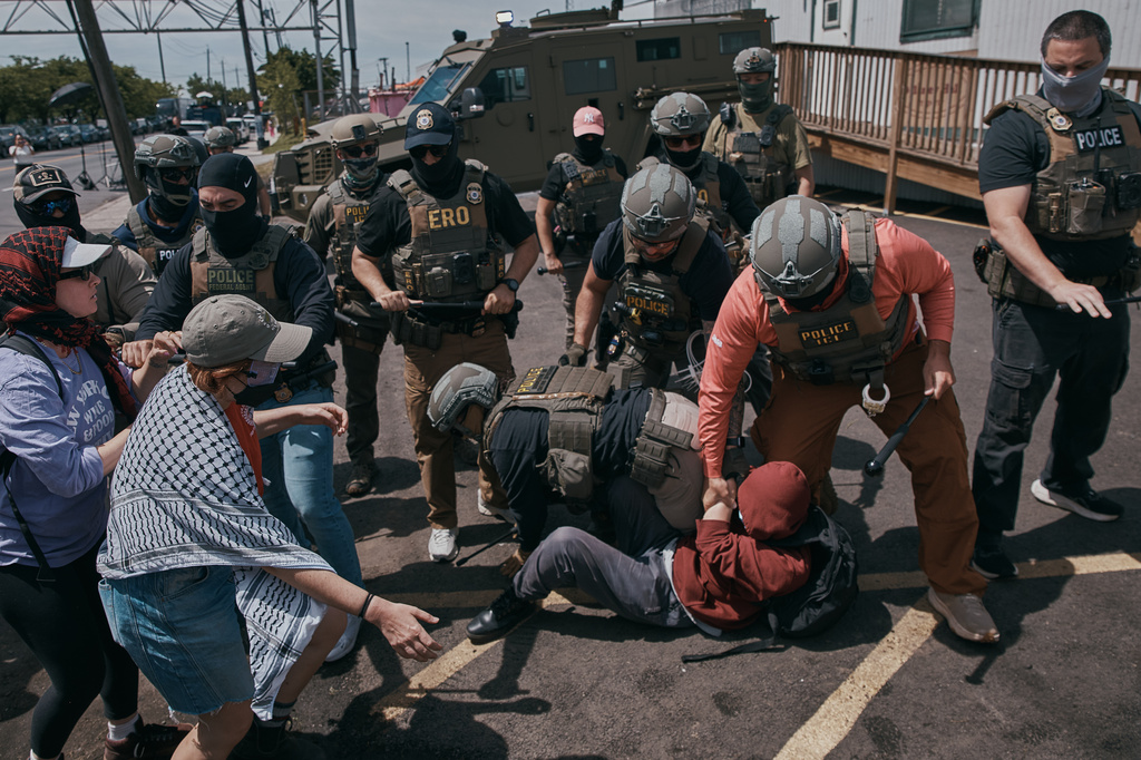 Protestors and ICE agents clash outside the Delaney Hall detention center after demonstrators stood by the entrance gates to protest the transfer of detainees on Tuesday, May 26, 2026, in Newark, N.J.