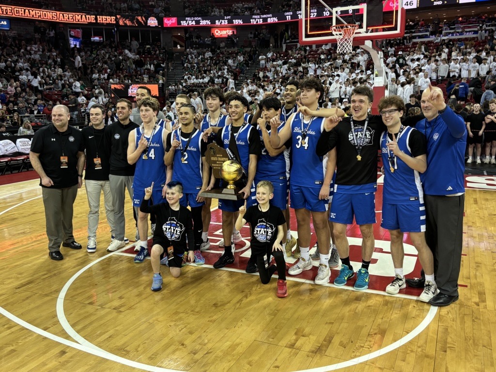 The Whitefish Bay Blue Dukes boys basketball team poses with its WIAA Division 2 state title after taking down Slinger 77-46 on Saturday, March 21, 2026, at the Kohl Center in Madison.