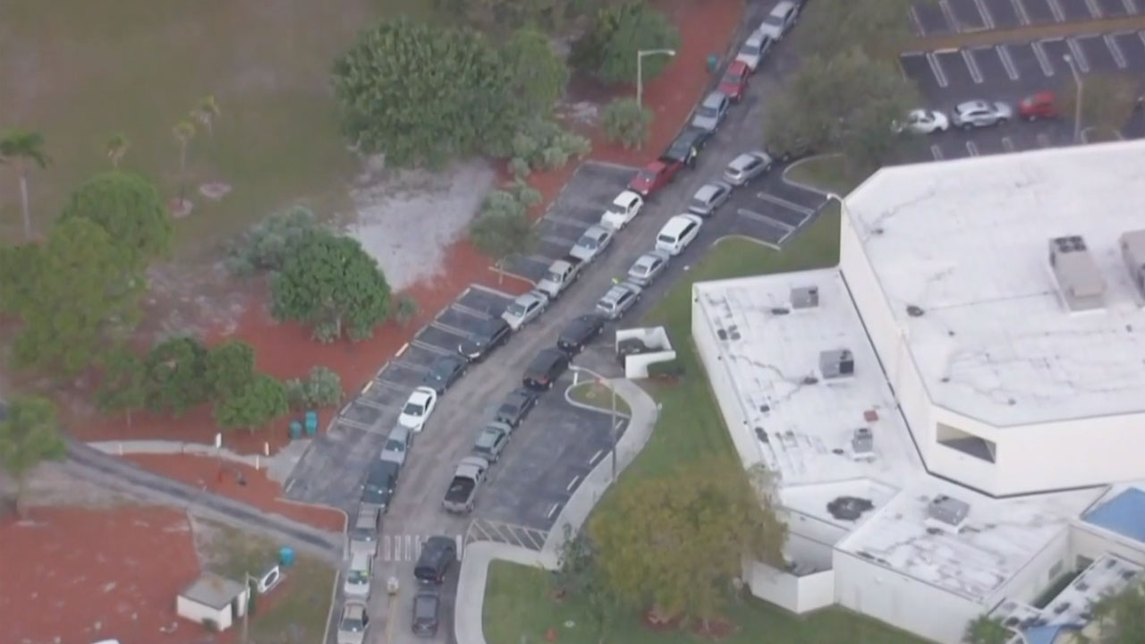 Cars lined up for food giveaway in Boynton Beach, Feb. 3, 2022