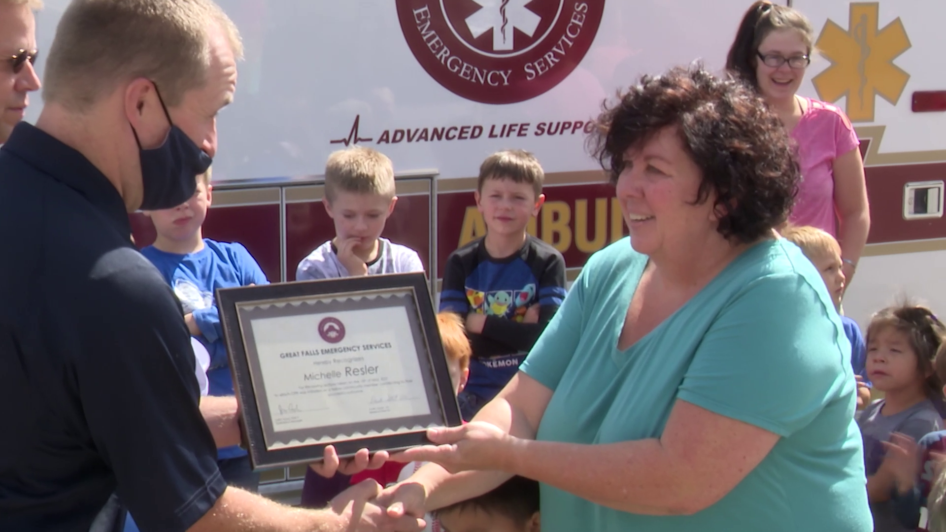Michelle Resler presented with a "life saver" certificate