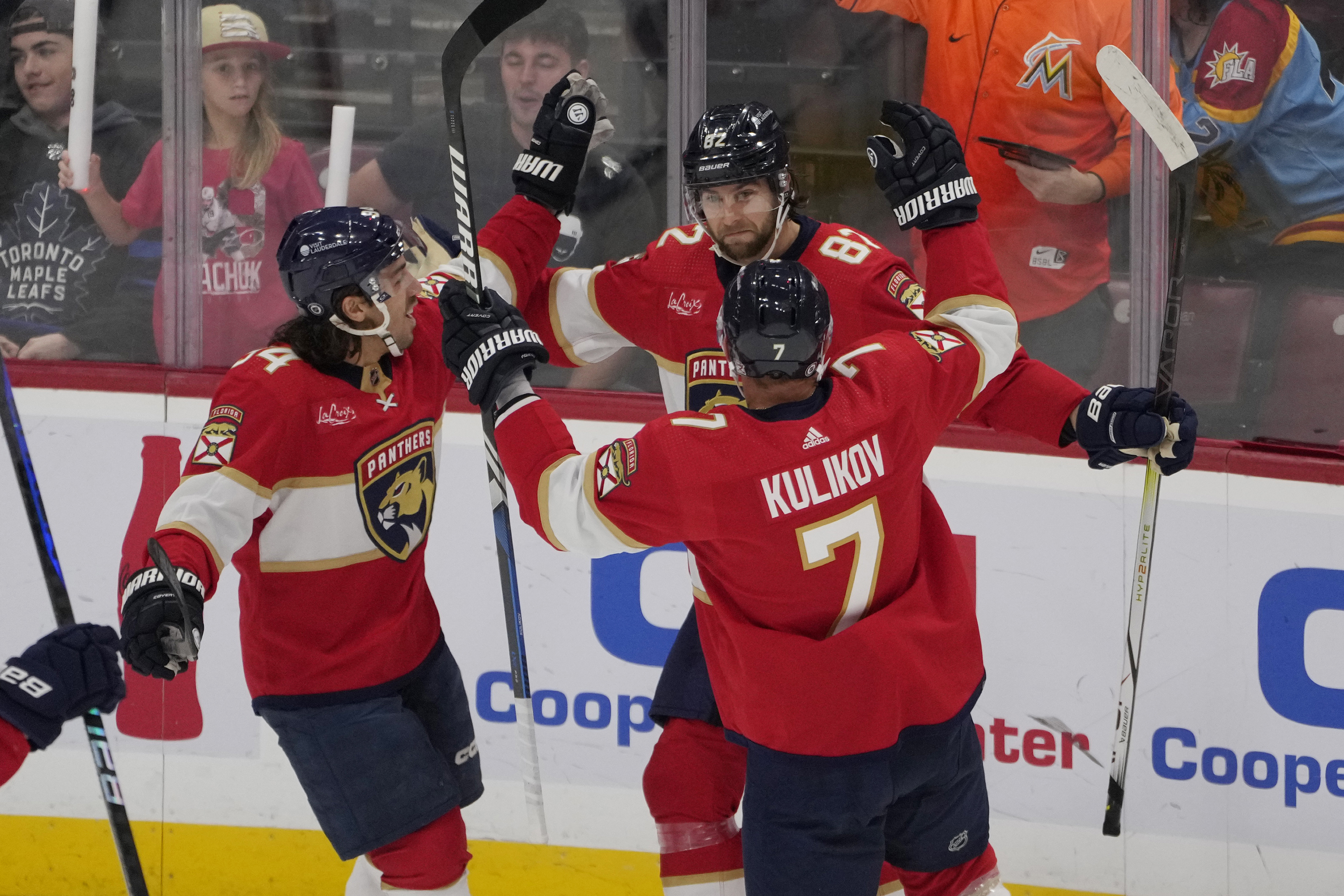 Florida Panthers center Kevin Stenlund congratulated by defenseman Dmitry Kulikov and left wing Ryan Lomberg vs. Toronto Maple Leafs, Oct. 19, 2023