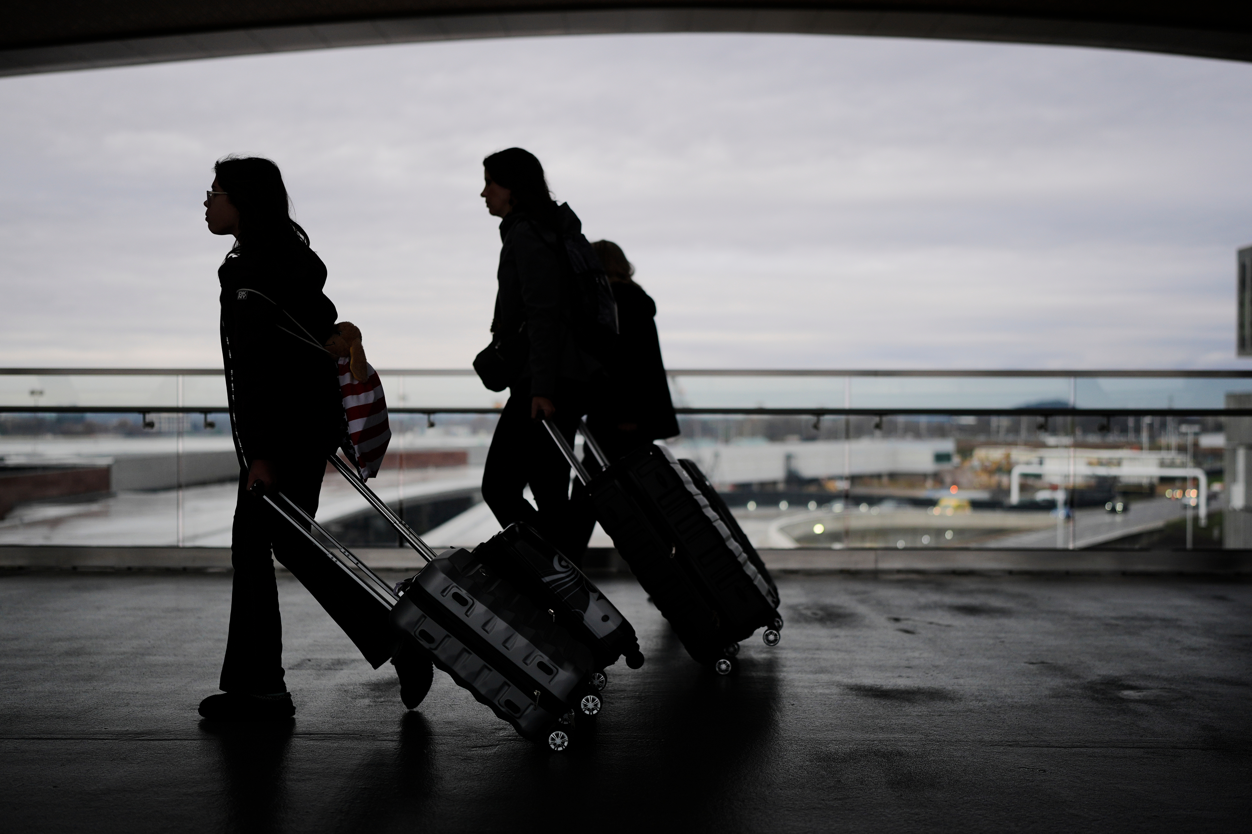 Travelers make their way through the Nashville International Airport, Tuesday, Nov. 25, 2025, in Nashville, Tenn.
