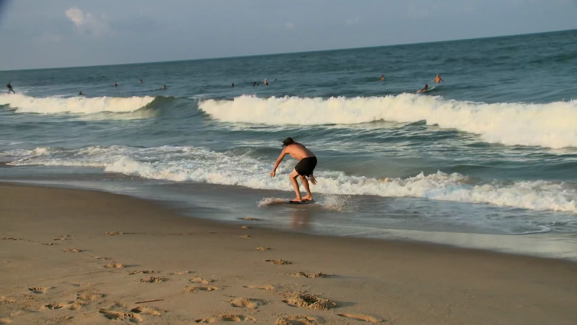 Skim boarder at Virginia Beach Oceanfront