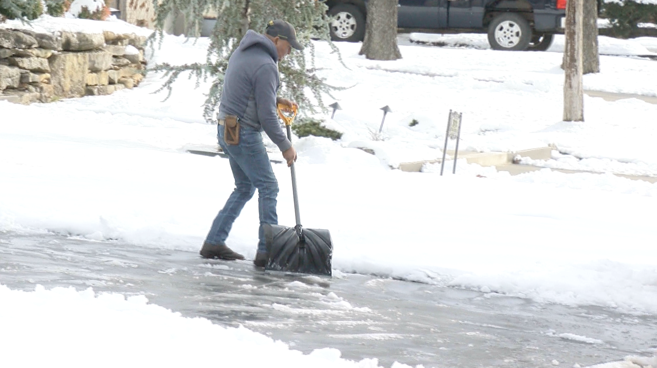 Neighbors shoveling snow