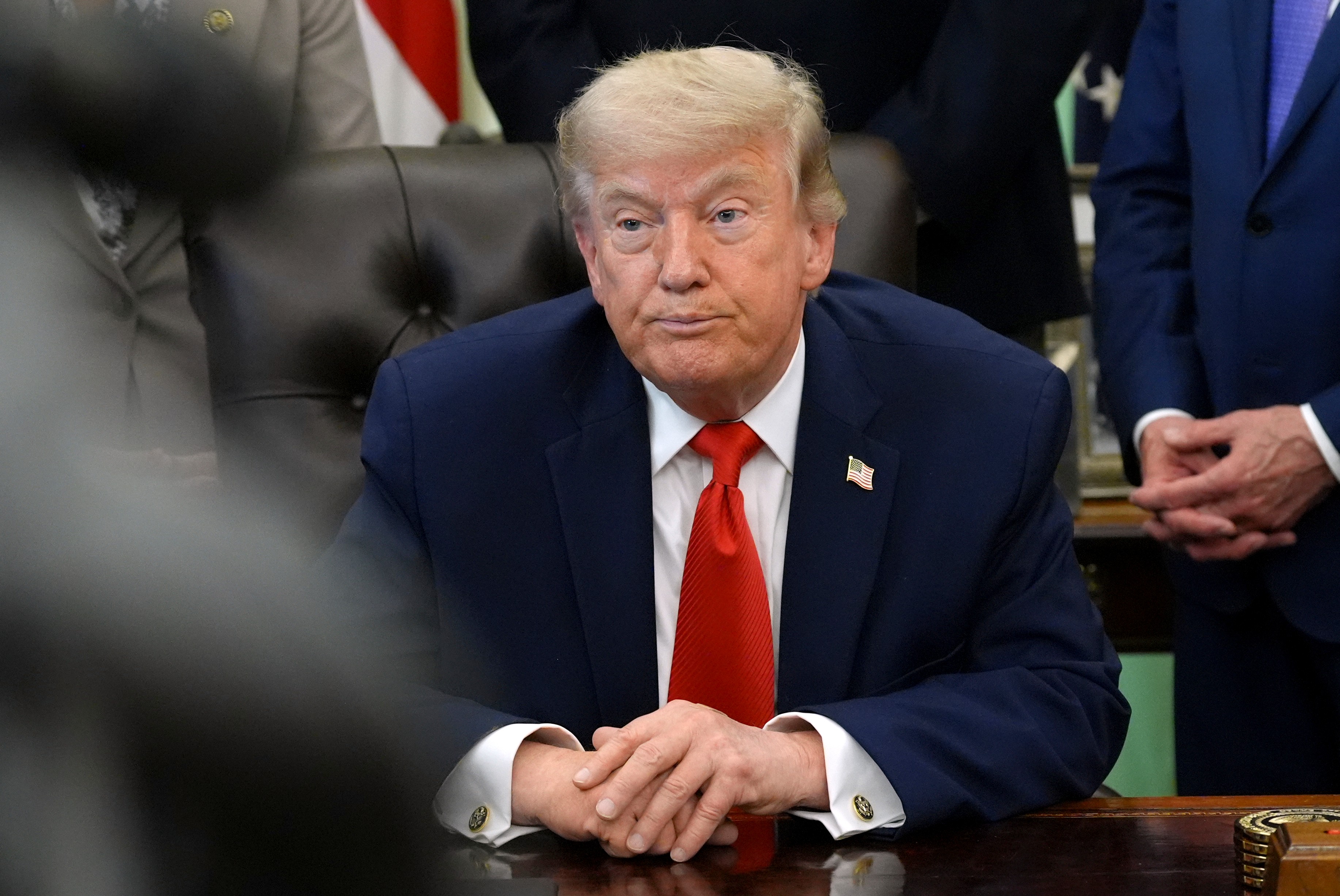 President Donald Trump listens during an event to sign a proclamation about the fishing industry, in the Oval Office of the White House, Thursday, June 11, 2026, in Washington.