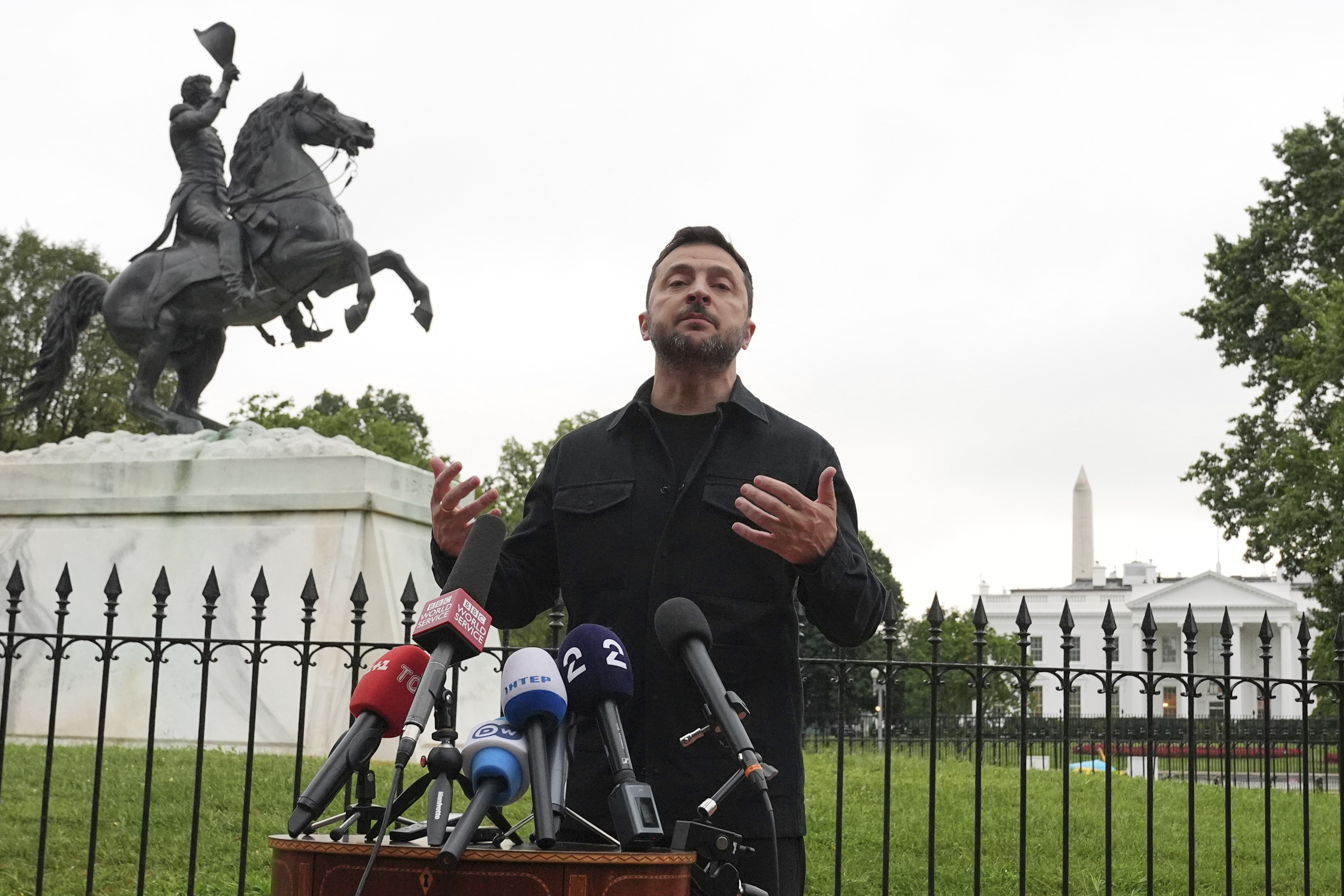 Ukraine's President Volodymyr Zelenskyy speaks in Lafayette Park, across from the White House, after meeting with President Donald Trump and European leaders Monday, Aug. 18, 2025, in Washington. 