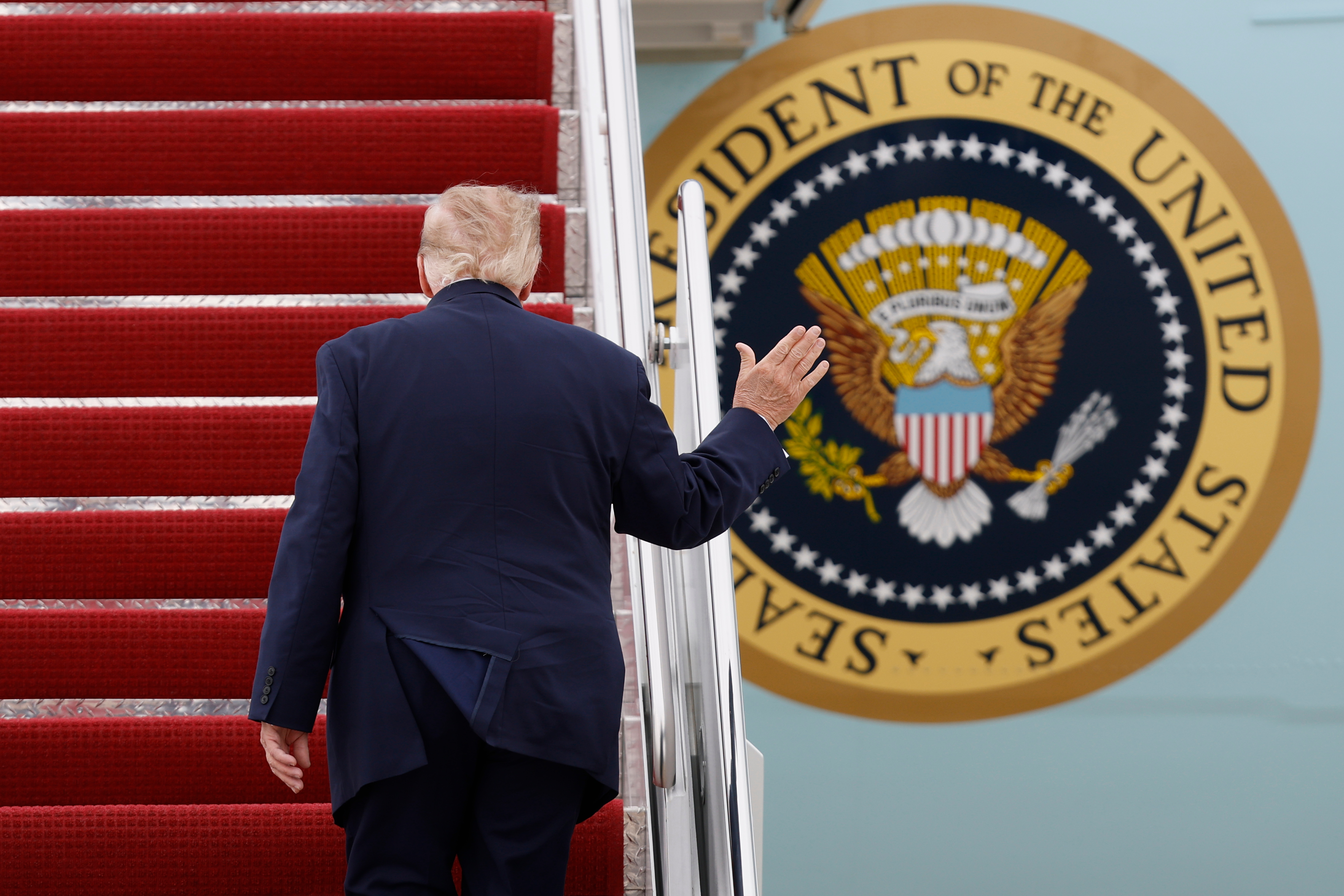 President Donald Trump walks up the stairs of Air Force One upon his departure at Joint Base Andrews, Md., Saturday, Sept. 26, 2026.