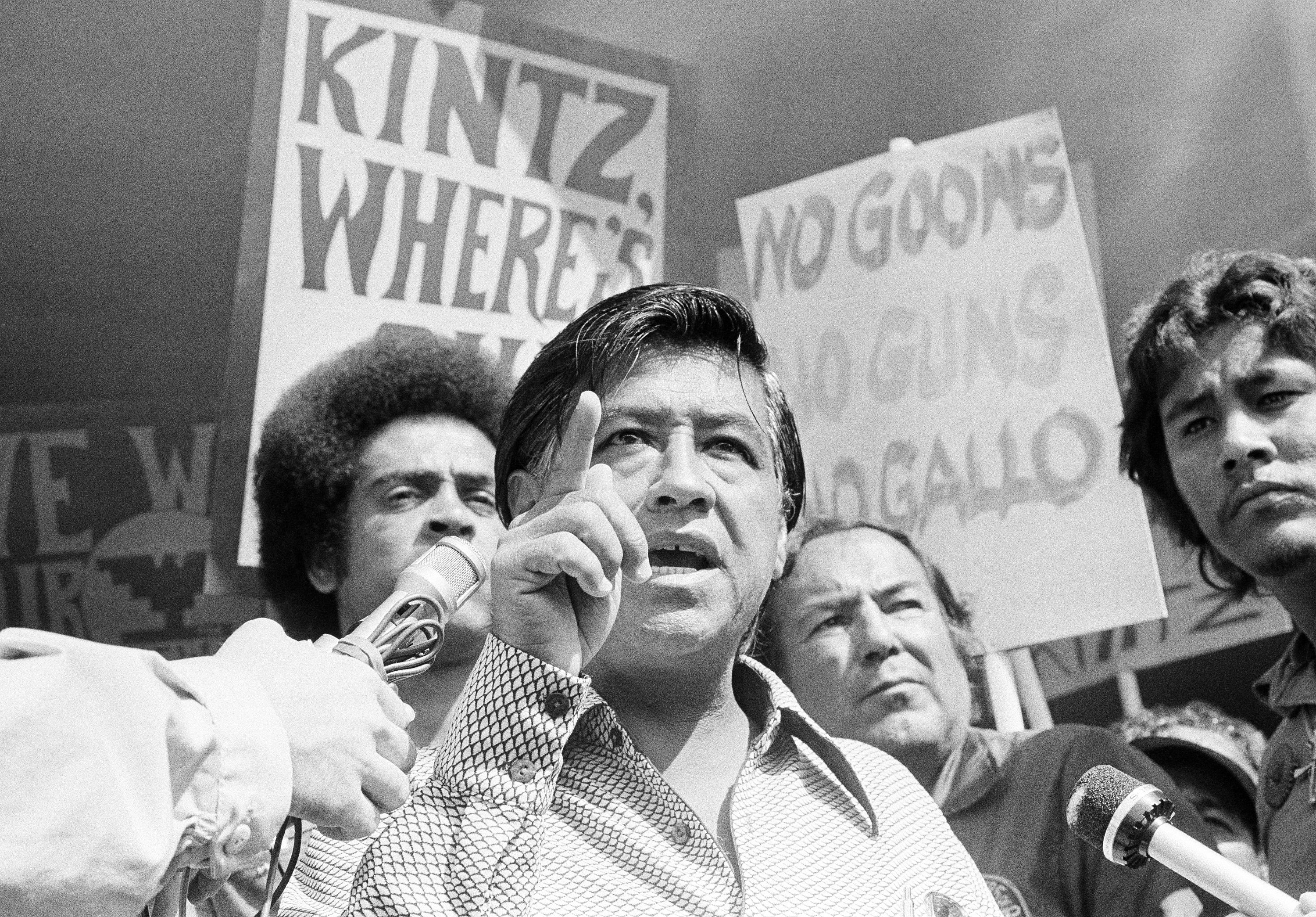 Cesar Chavez, center, speaking in a news conference, Sept. 16, 1975.