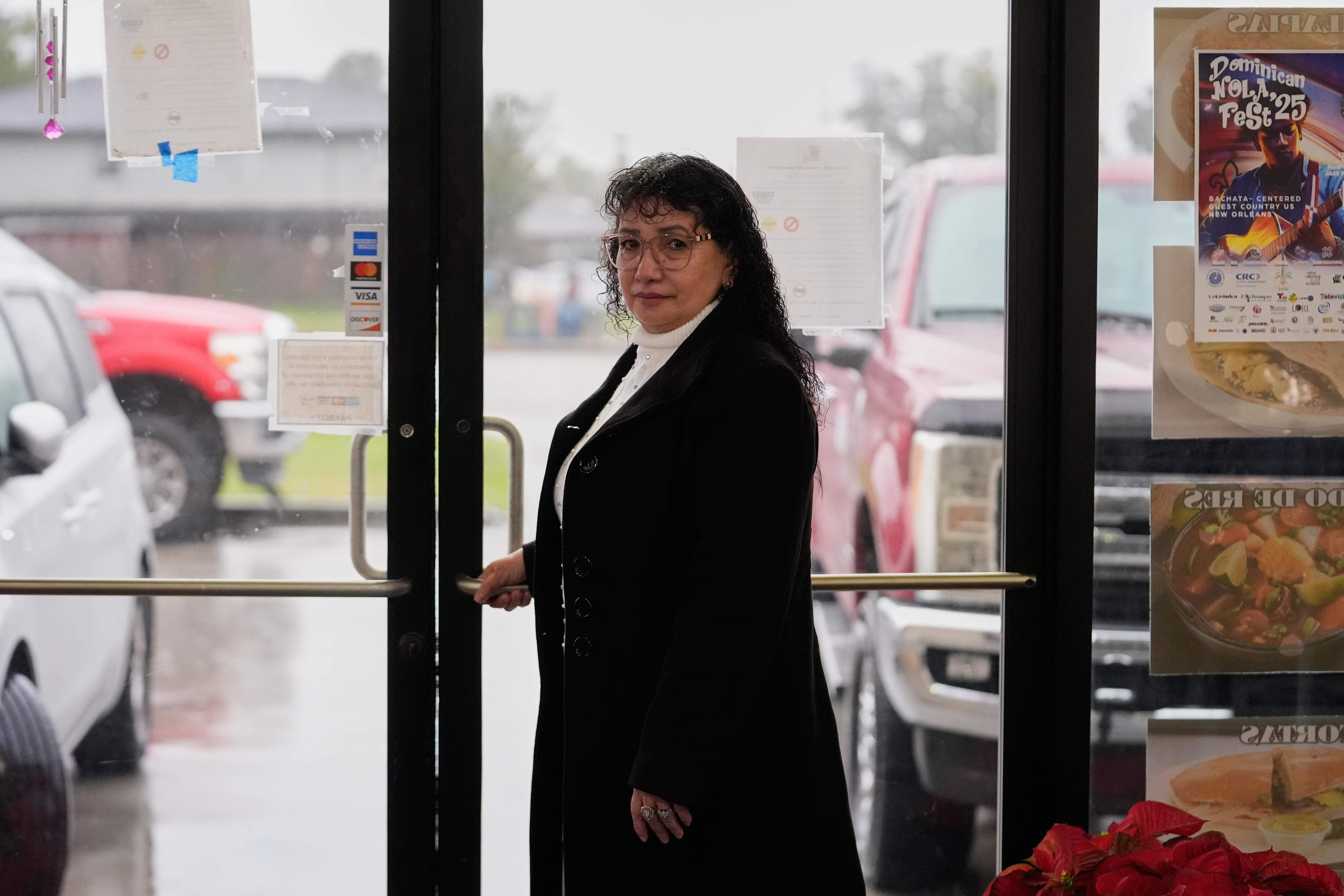 Carmela Diaz poses inside her closed restaurant in the midst of a Customs and Border Protection immigration crackdown in Kenner, La., Thursday, Dec. 4, 2025.