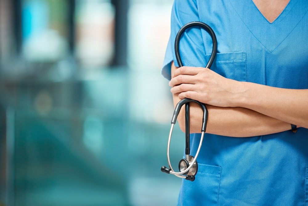 Stock image of a nurse holding a stethoscope.