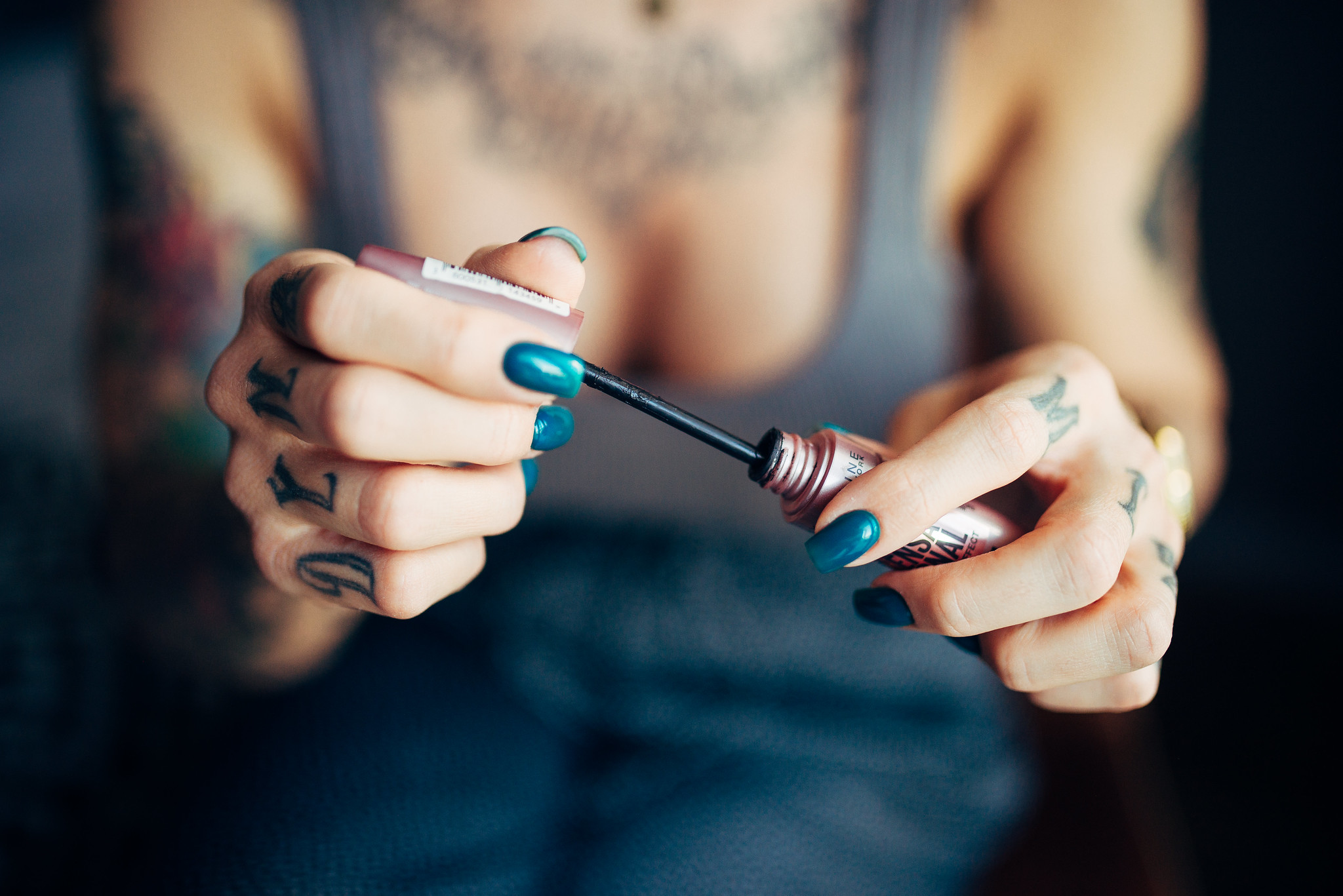 Woman applying mascara makeup