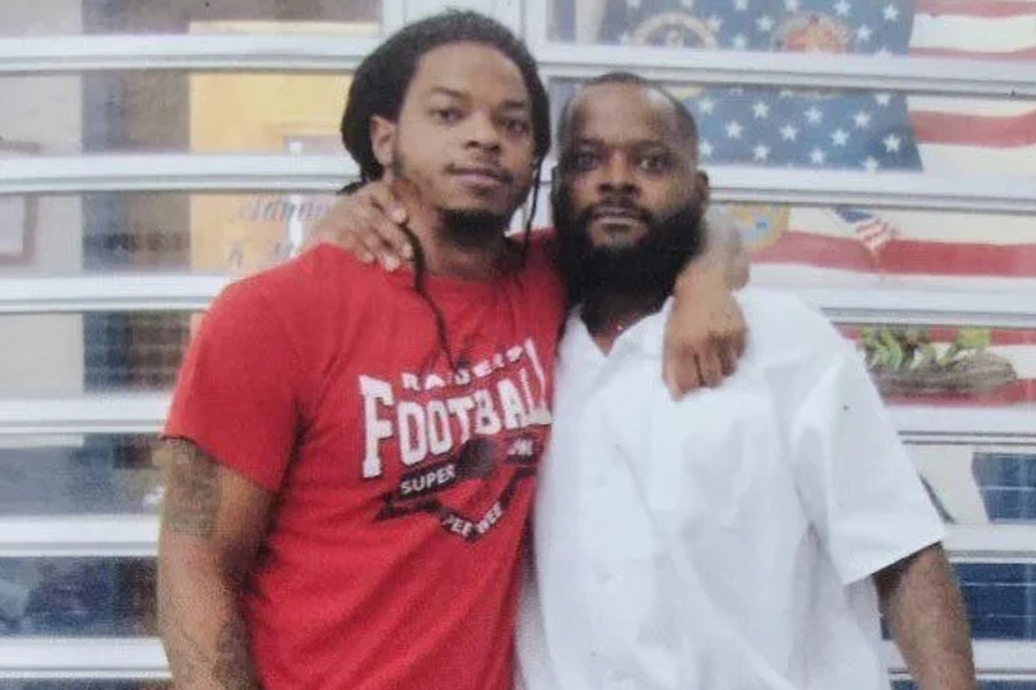 In this undated photo provided by the Johnson family on Tuesday, Oct. 20, 2026, Toforest Johnson, right, poses for a photo with his son, Robby Foster.