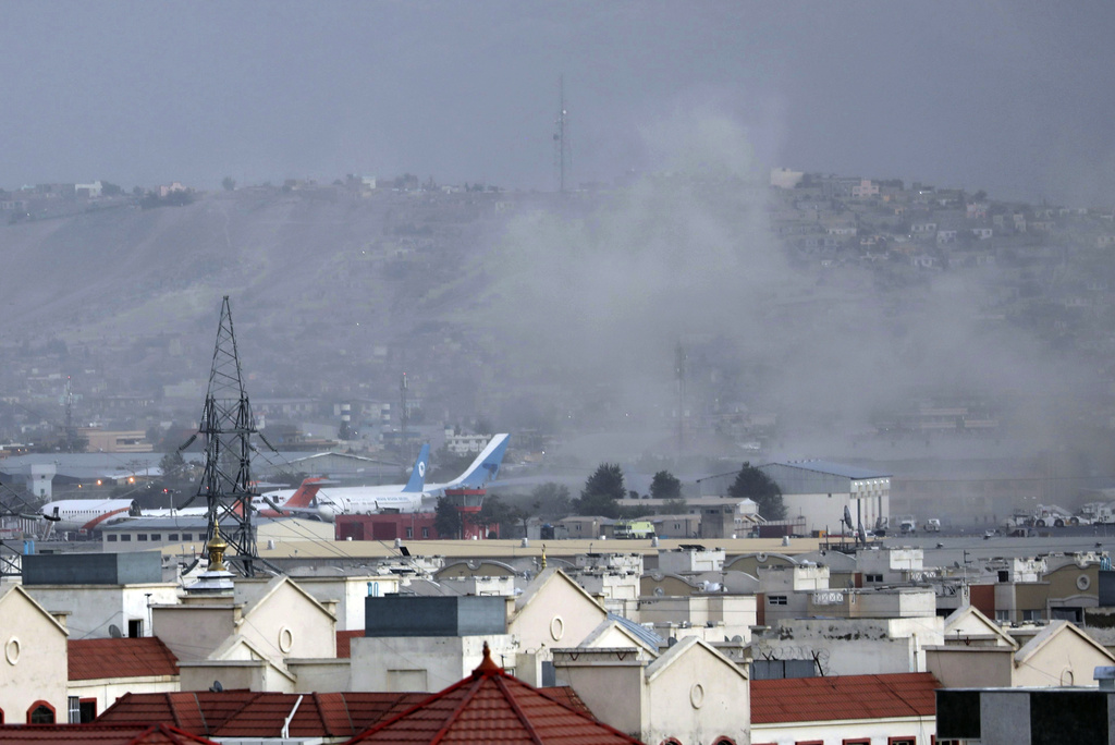 Smoke rises from a deadly explosion outside the airport in Kabul, Afghanistan, Thursday, Aug. 26, 2021.