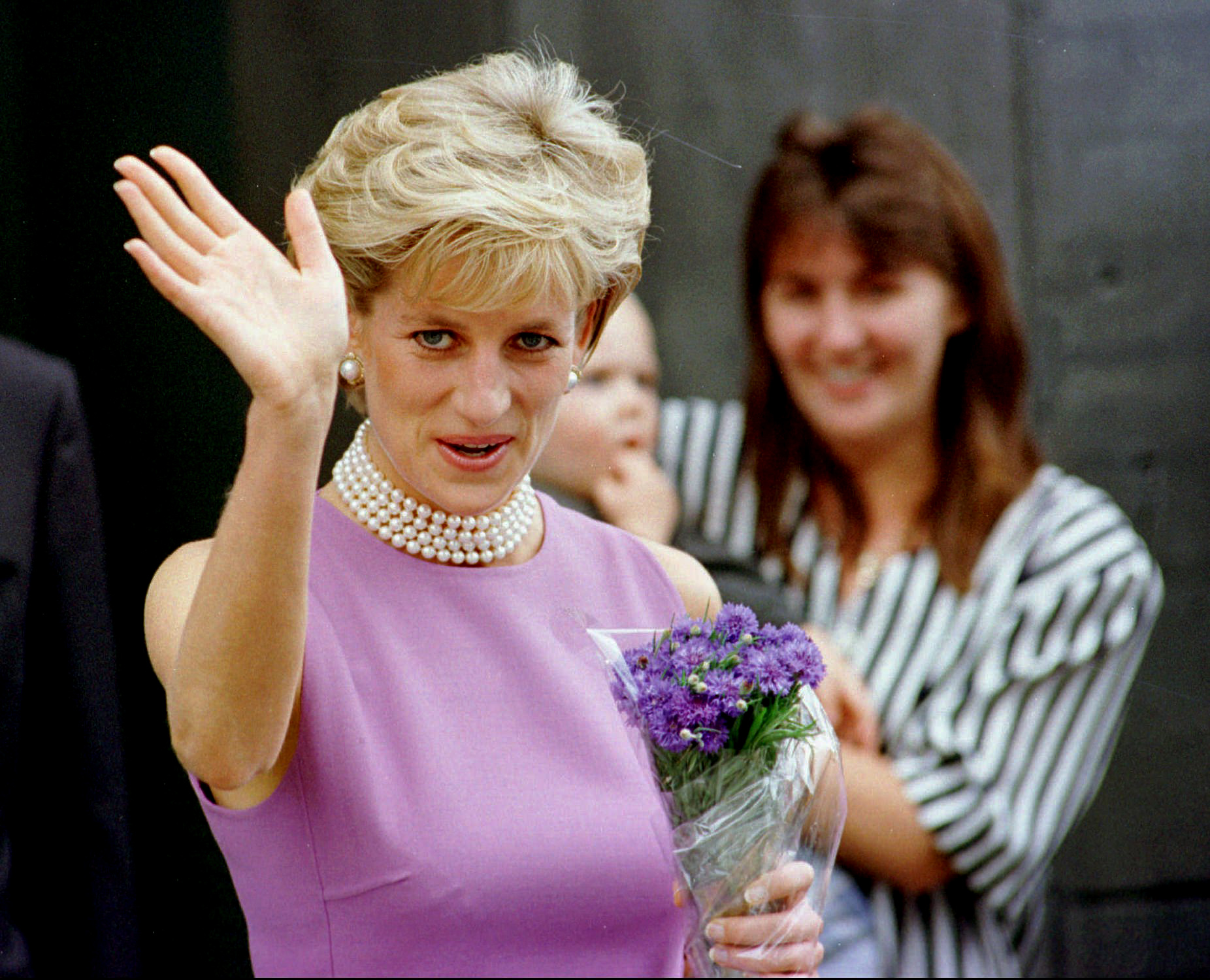 FILE - Diana, Princess of Wales waves to the crowd as she leaves the Victor Chang Cardiac Research Institute in Sydney Australia, Friday, Nov. 1, 1996.