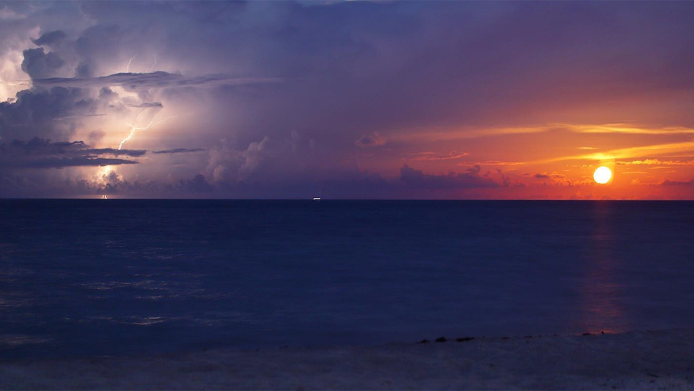 WPTV photojournalist Kaan Pala was in the right place at the right time July 17, 2019 to capture a lightning strike alongside a moonrise off the coast of Jupiter, Fla.