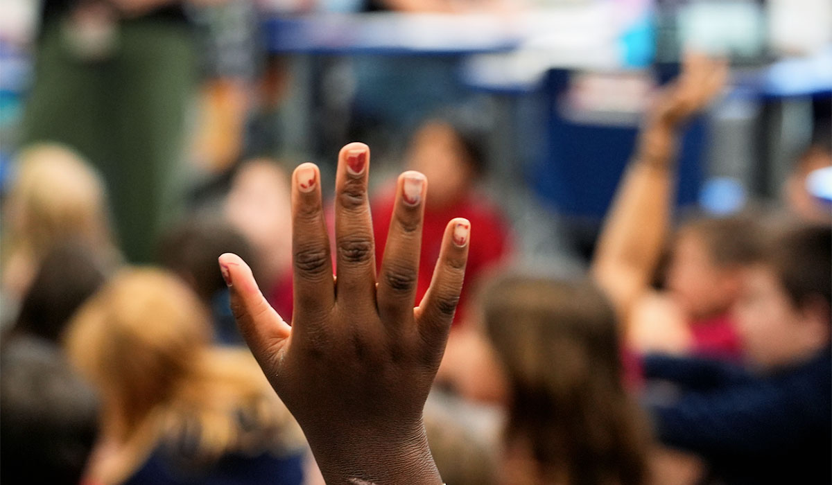 Student with hand up 