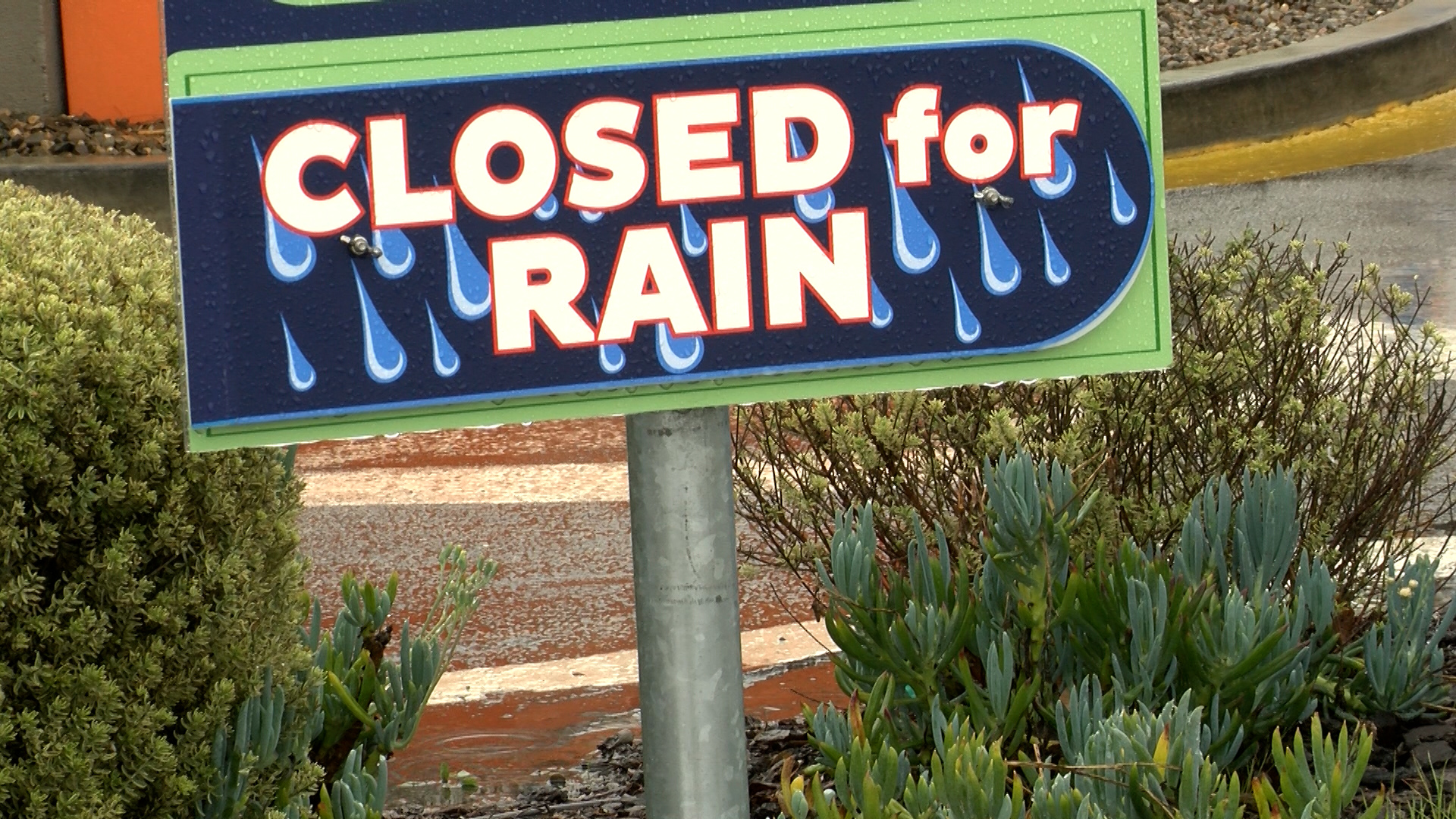 Quiky Car Wash in San Luis Obispo placed a sign to let customers know they are closed due to the ongoing rain.