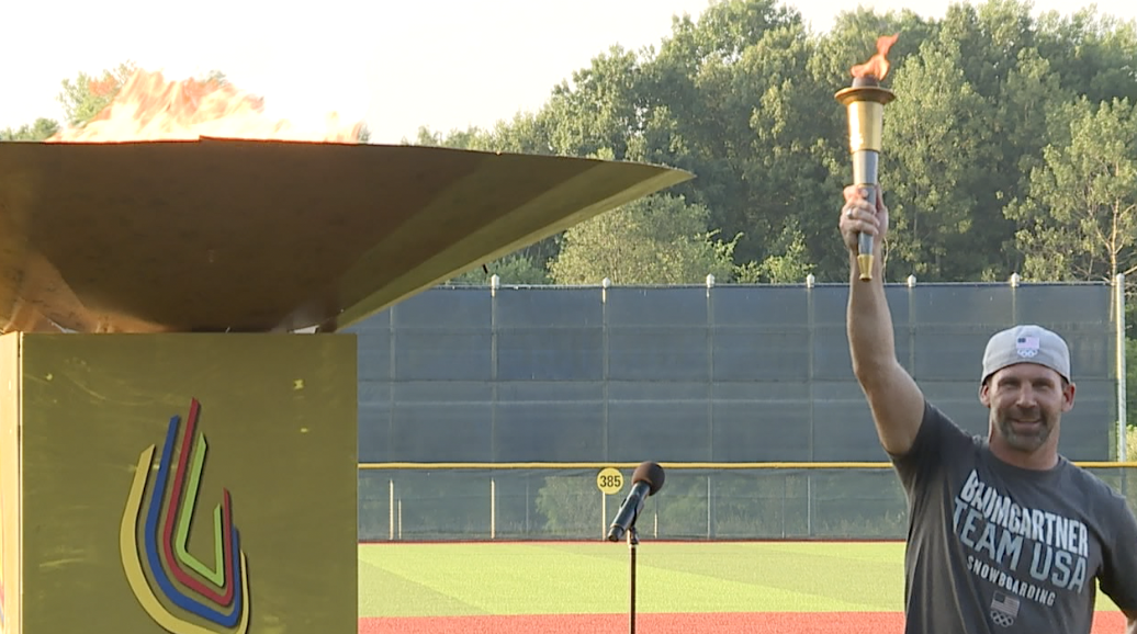 Nick Bumgartner lights the torch for the Meijer State games