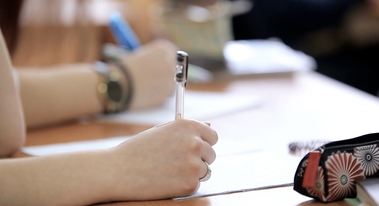 students writing in school