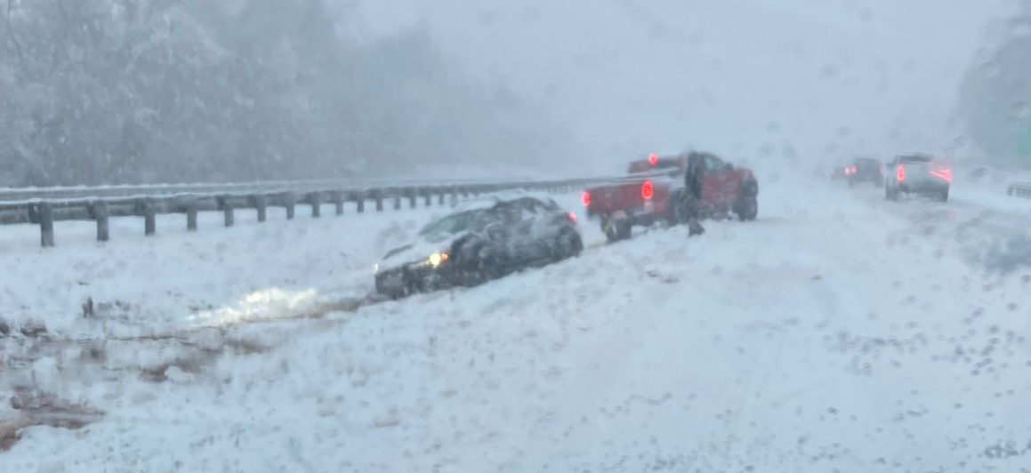 Virginia State Police car stuck in snow.png